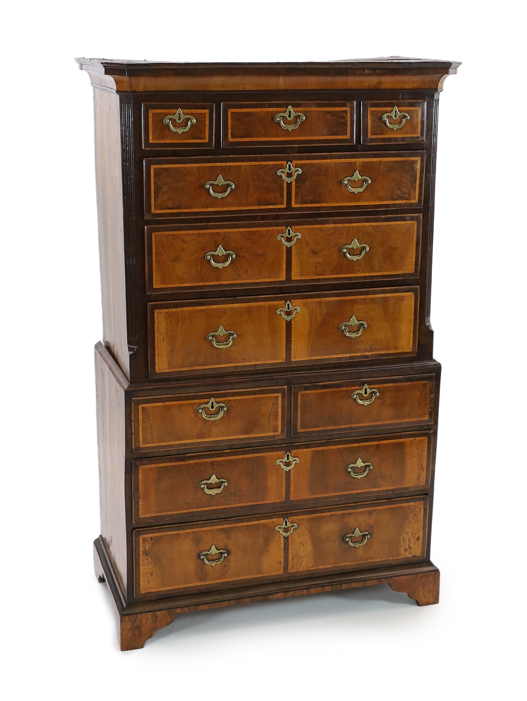 A George II featherbanded walnut chest on chest, width 100cm, depth 51cm, height 165cm